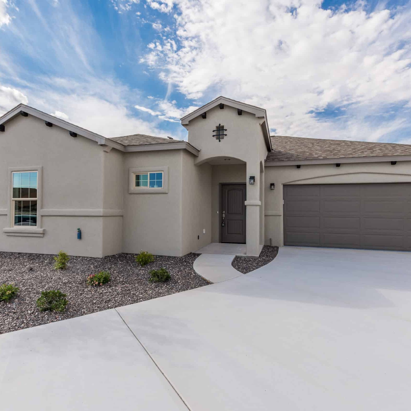 Mesilla New Home Builder for Gray Stucco Home